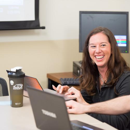 PE/HE Professor helping a student