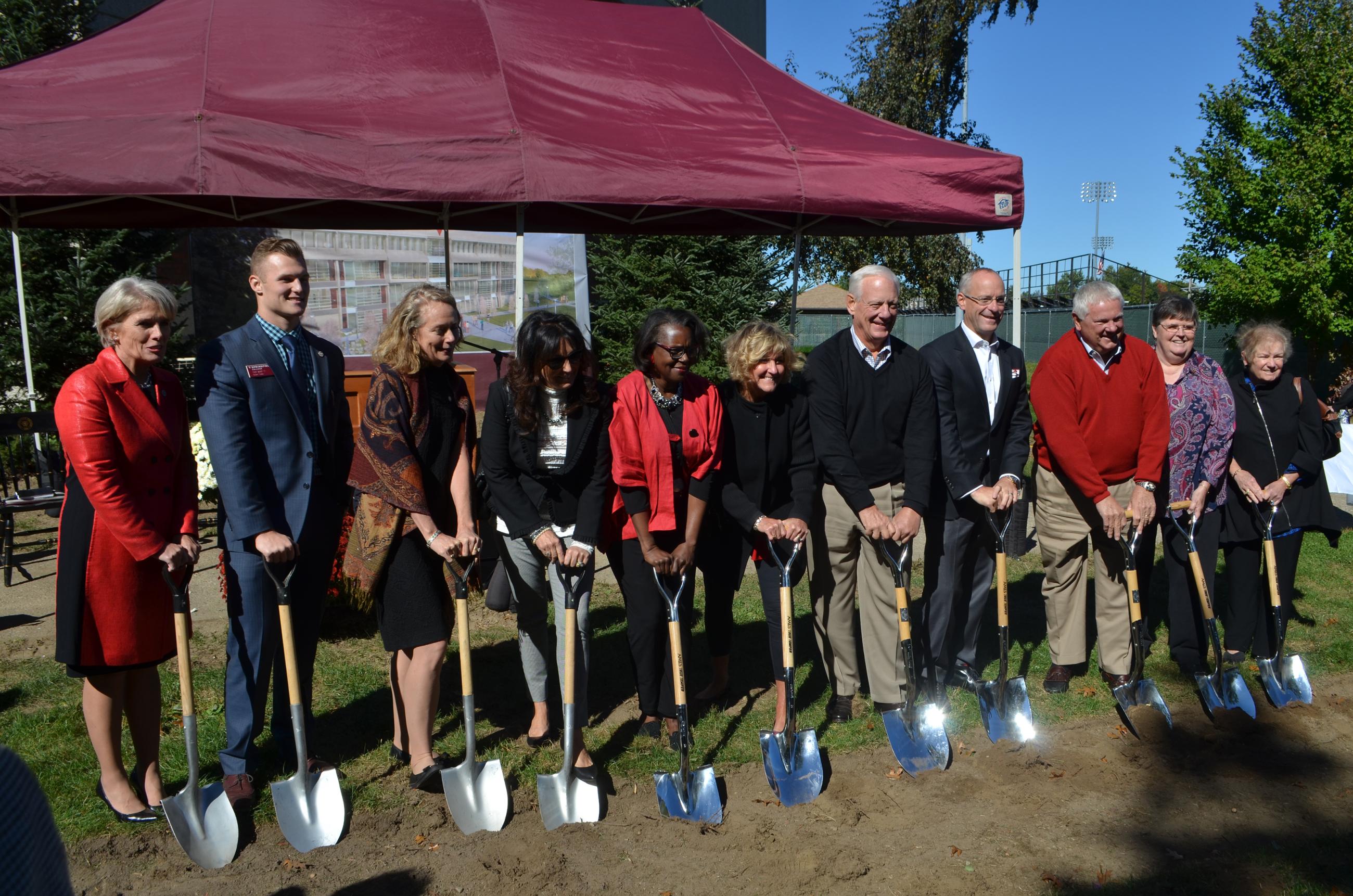 A photo from the groundbreaking of the Learning Commons featuring many leaders from the College.