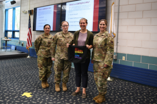 At left, Master Sgt. Marilyn Morales, a 104FW first sergeant, Master Sgt. Shelley Mutti, the event organizer, Elizabeth Morgan, Ph.D., and Chief Master Sgt. Laurice Souron pose for a photo after the workshop. (U.S Air National Guard Photos by Master Sgt. Lindsey S. Watson)