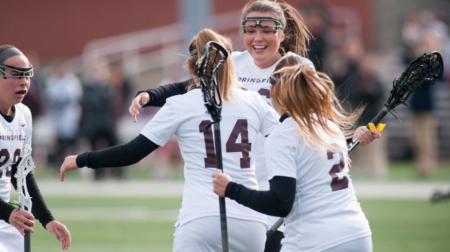 Springfield College women's lacrosse players celebrate a win