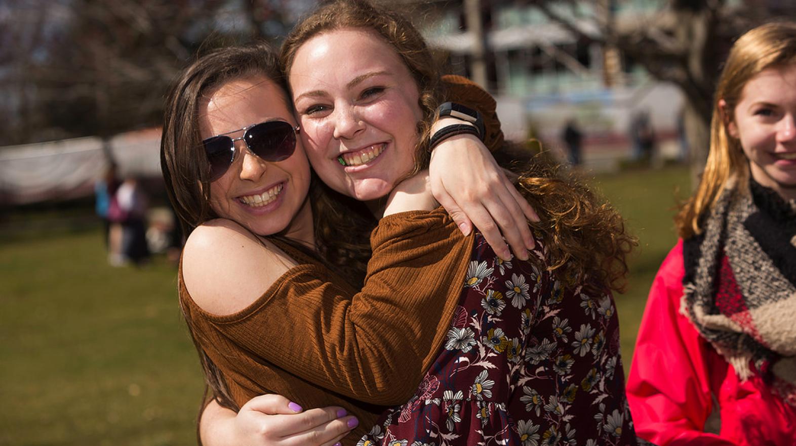 Friends hugging at Springfield College