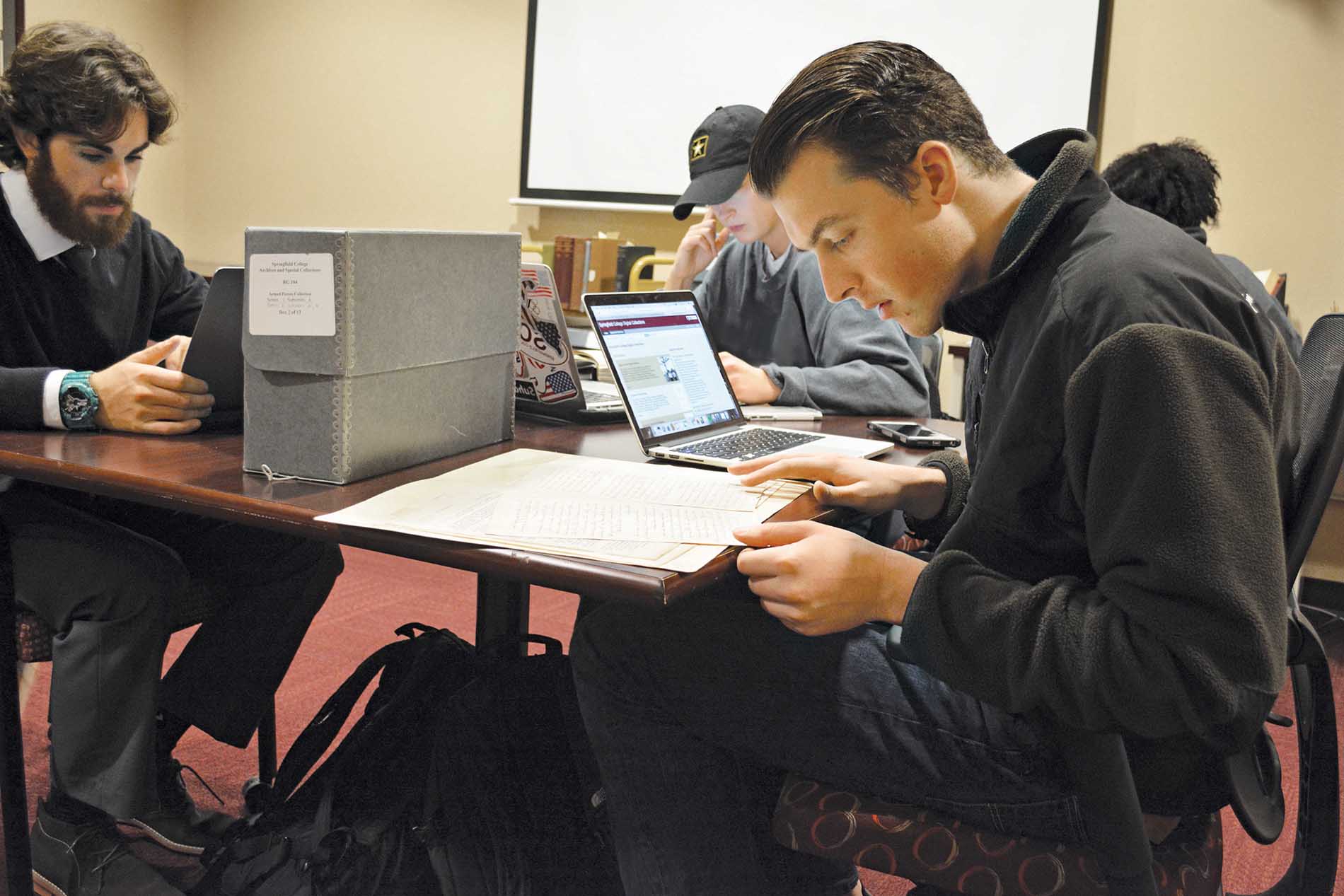 students research in college archives