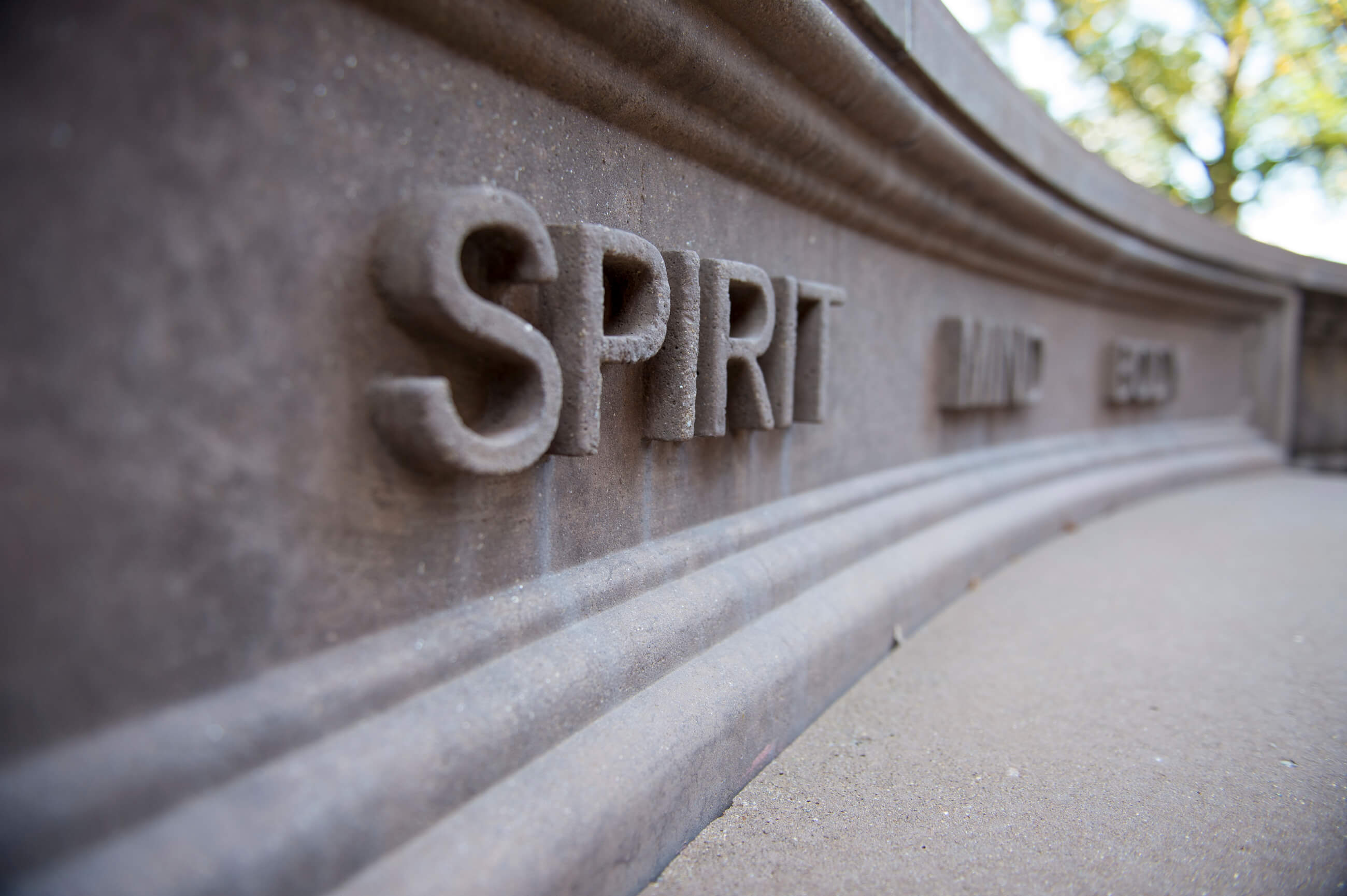 Bench at Springfield College that reads "spirit, mind, and body"