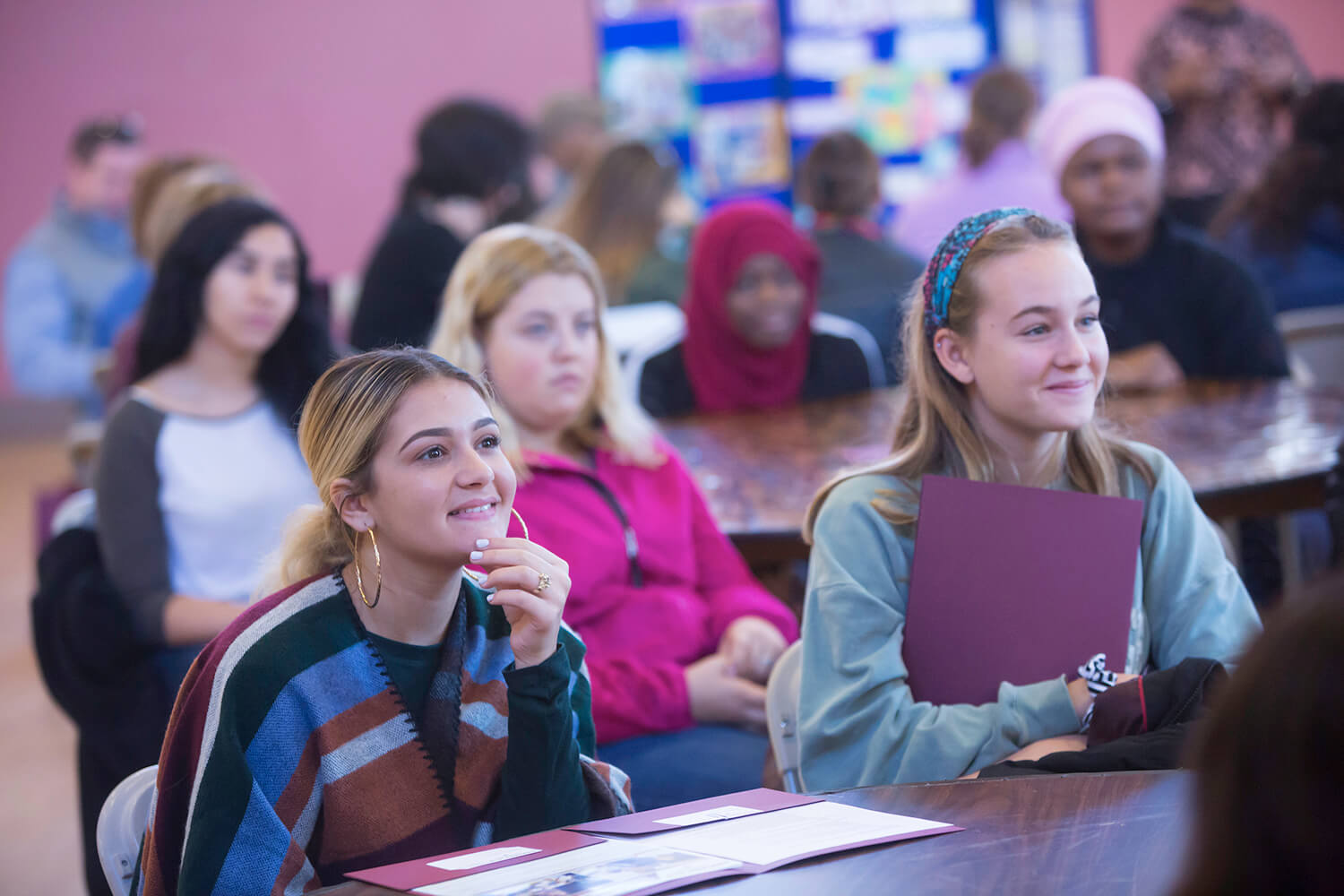 Students sit in a classroom during January Orientation.