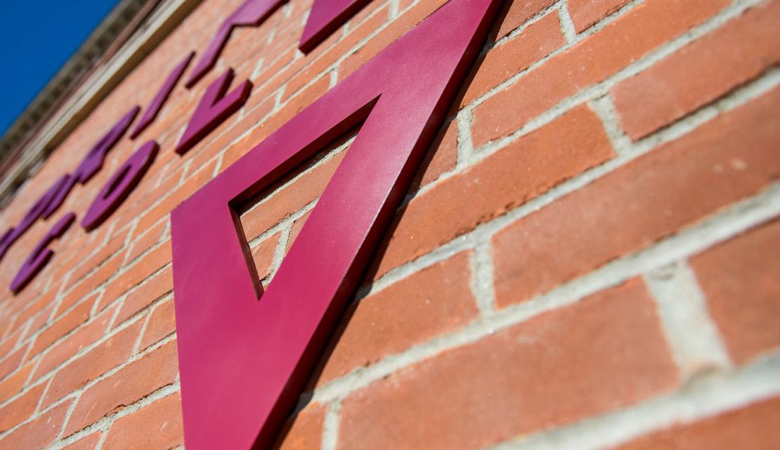 Triangle and logo on the side of Locklin Hall