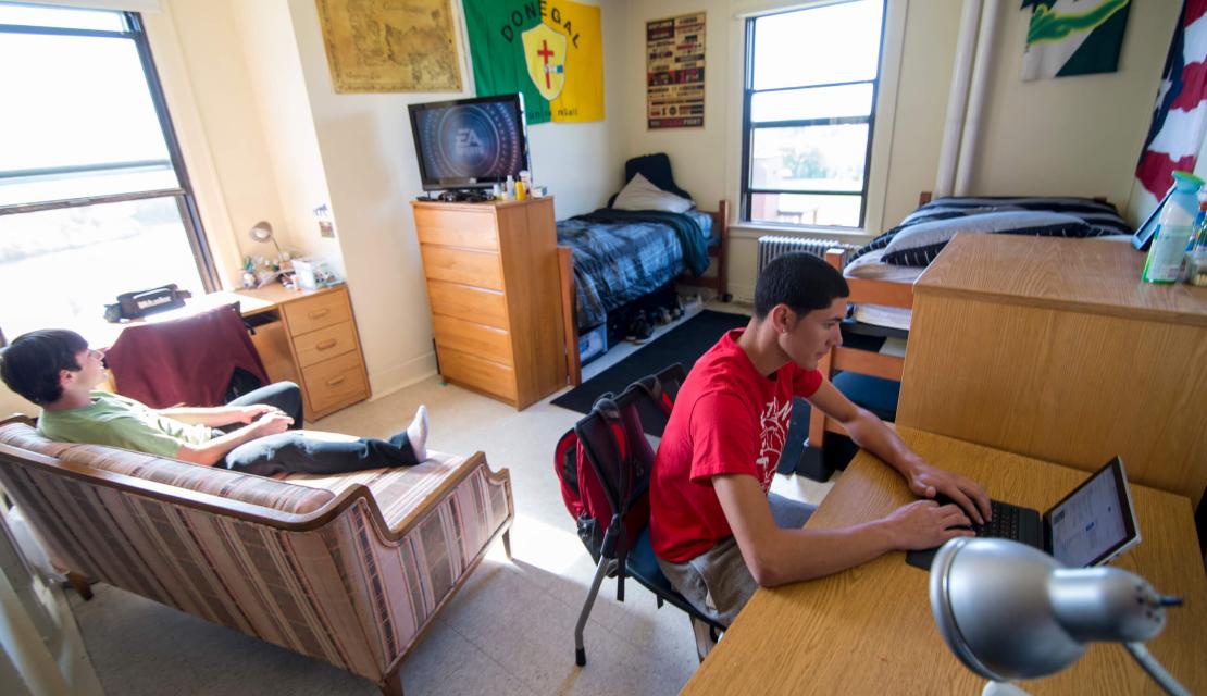 Two young men occupy a Springfield College residence hall room. 