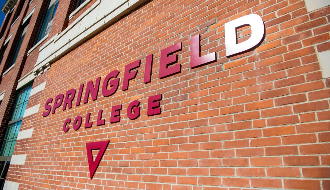A side view of the Springfield College sign on Locklin Hall