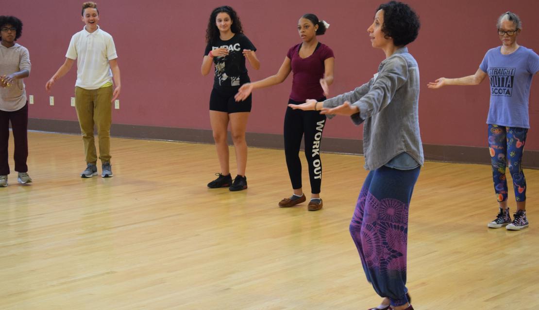 Andrea Vasquez teaches dance to a group of students