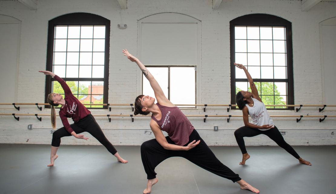 Dancers practice contemporary moves in the Springfield College dance studio