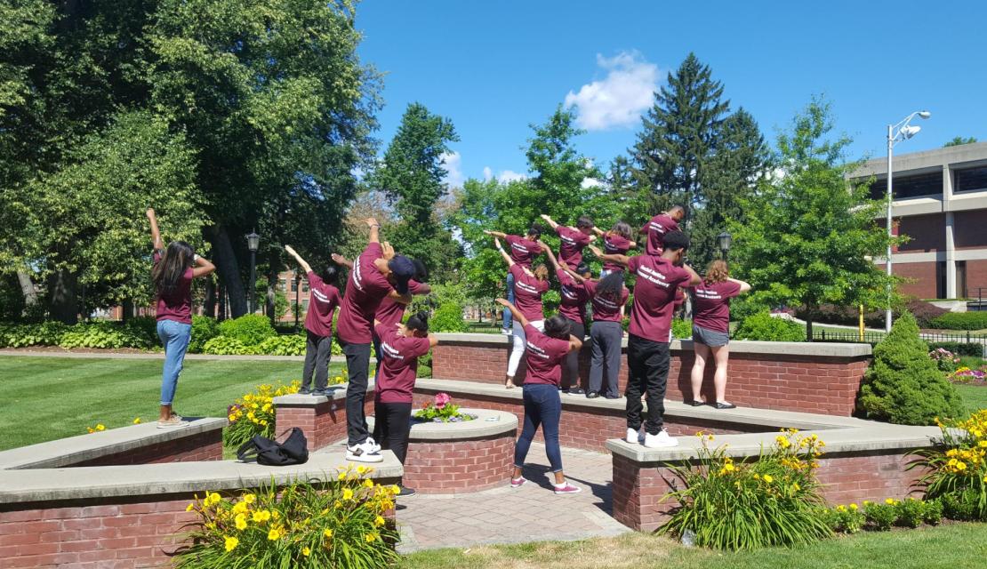 Students pose on Naismith Green as part of a summer inclusion program