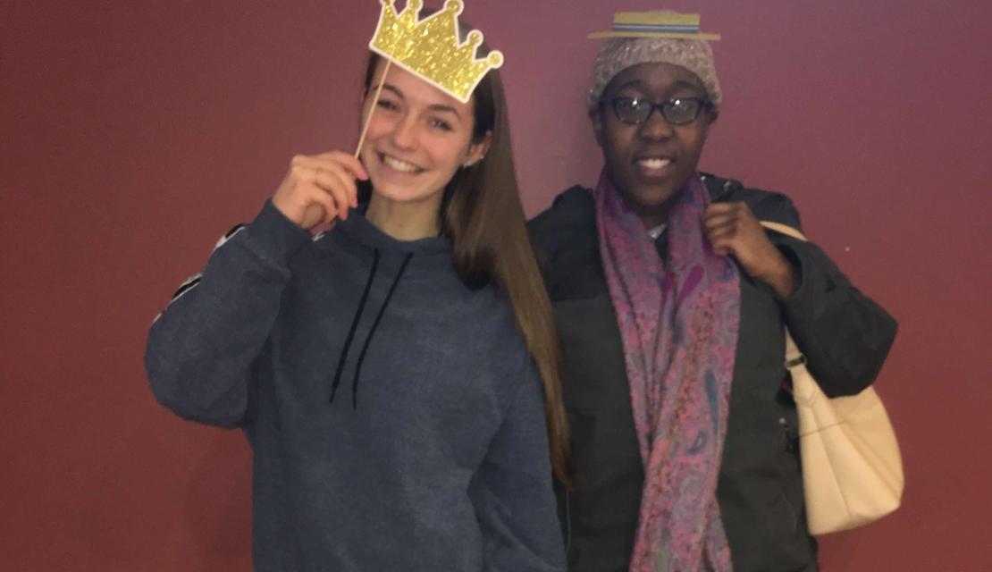Olivia Wetmore and a friend from Best Buddies program pose with props