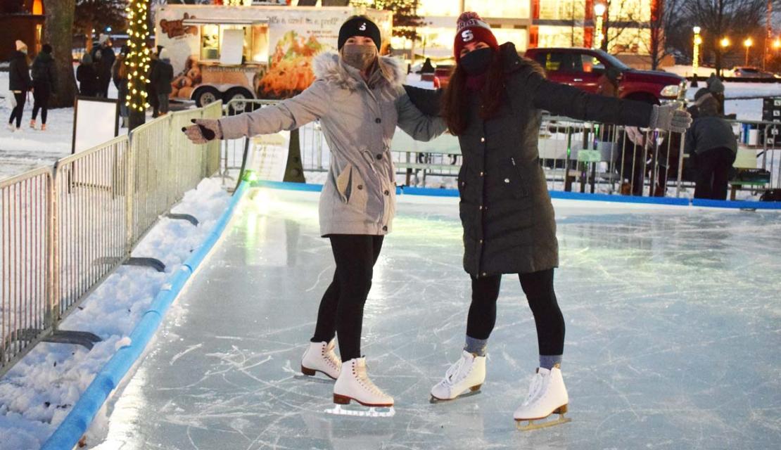 Two female skaters on the rink 