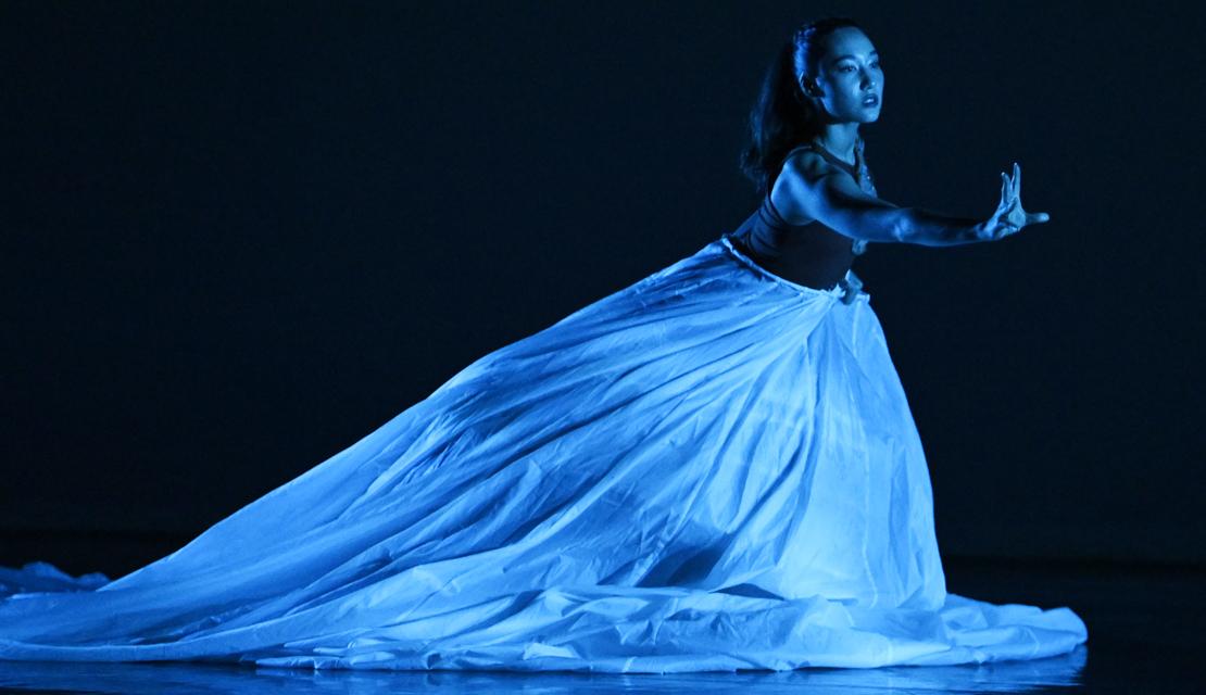 photo of a young woman onn stage during a dance performance