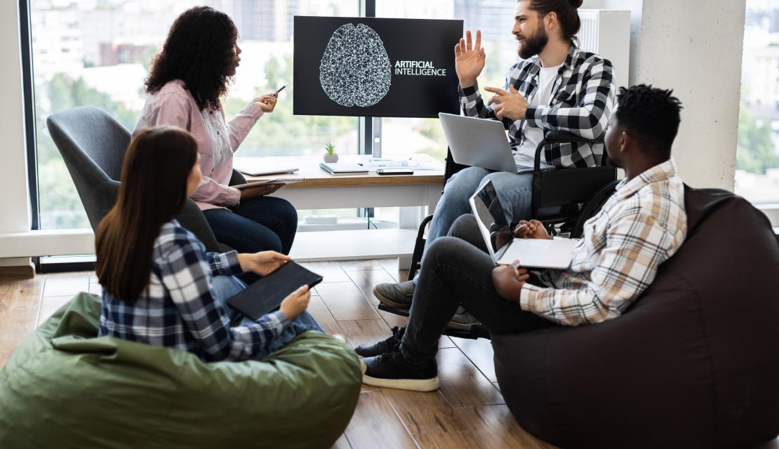 Team collaborating on artificial intelligence project in modern office setting stock photo