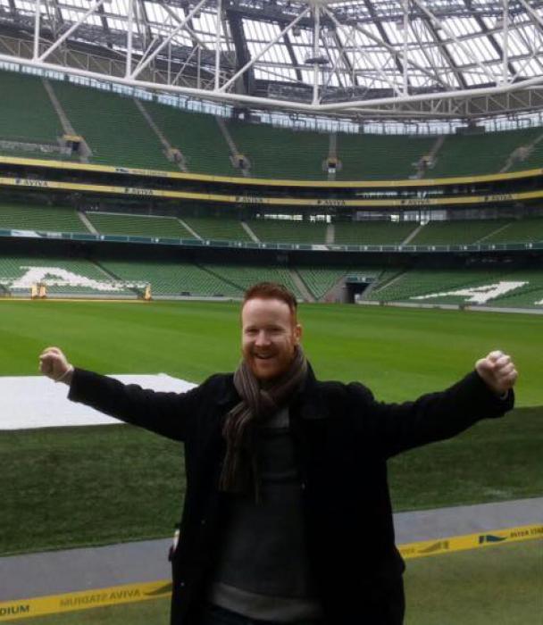 Ronan O'Rourke in front of a stadium. 
