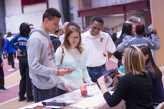 new student getting admissions information on open house day