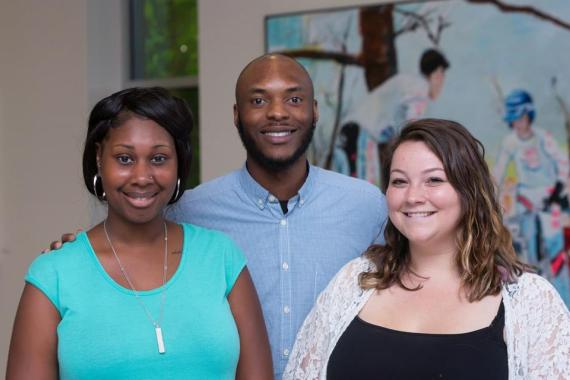 Students at the department of social work smile at the camera