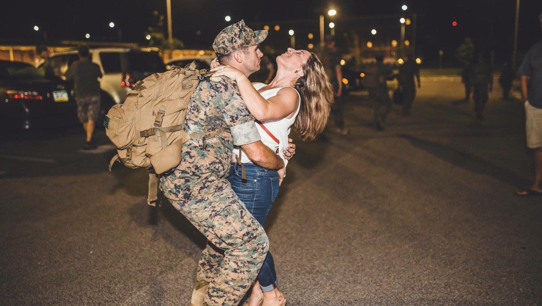 McDonald and her husband greet after a deployment. 