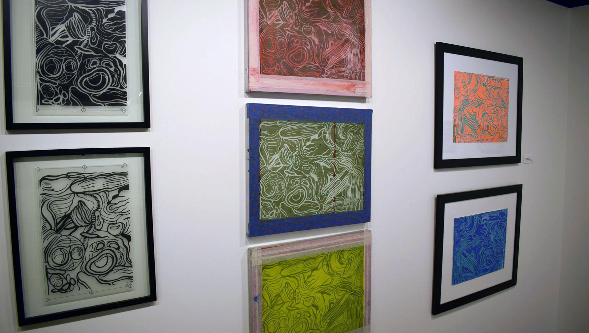 image of paintings hung in a gallery