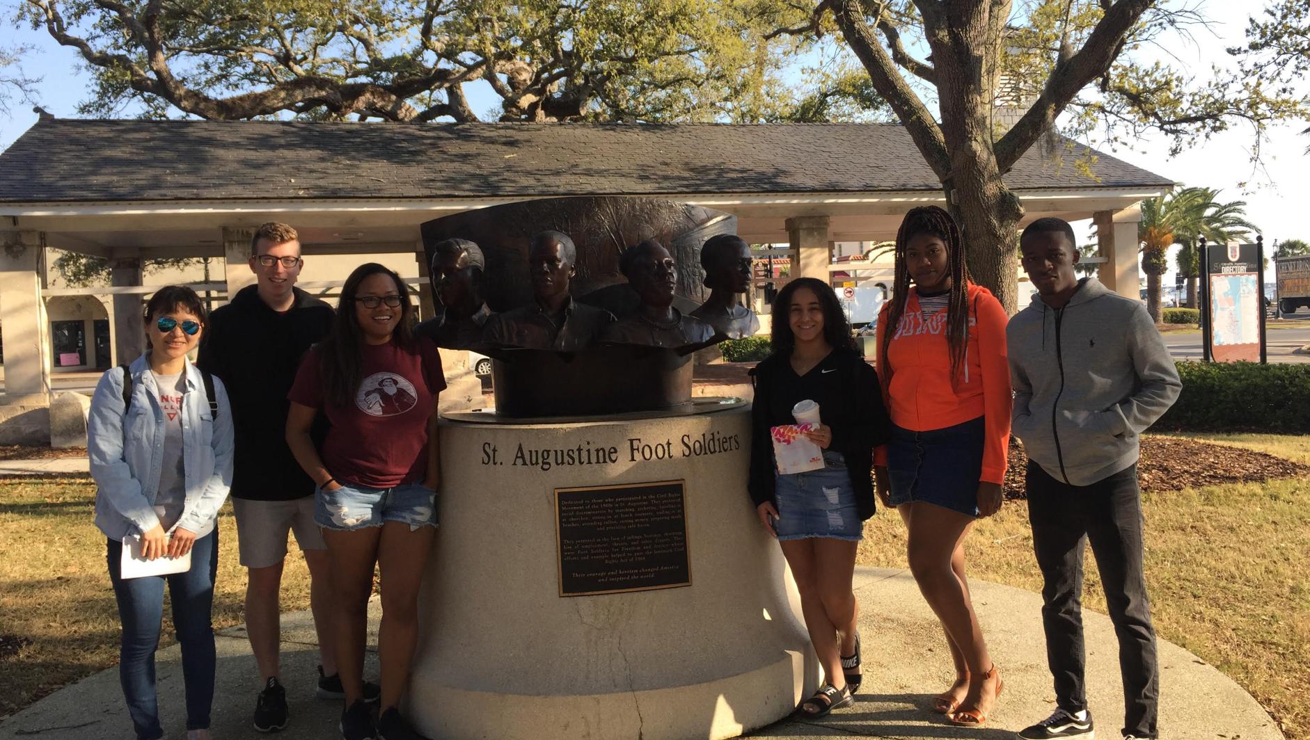 Students posed in front of the Foot Soldiers monument in St. Augustine. 