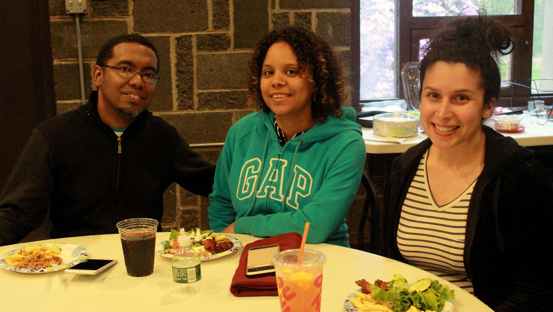 three students at a Graduate Student Organization event