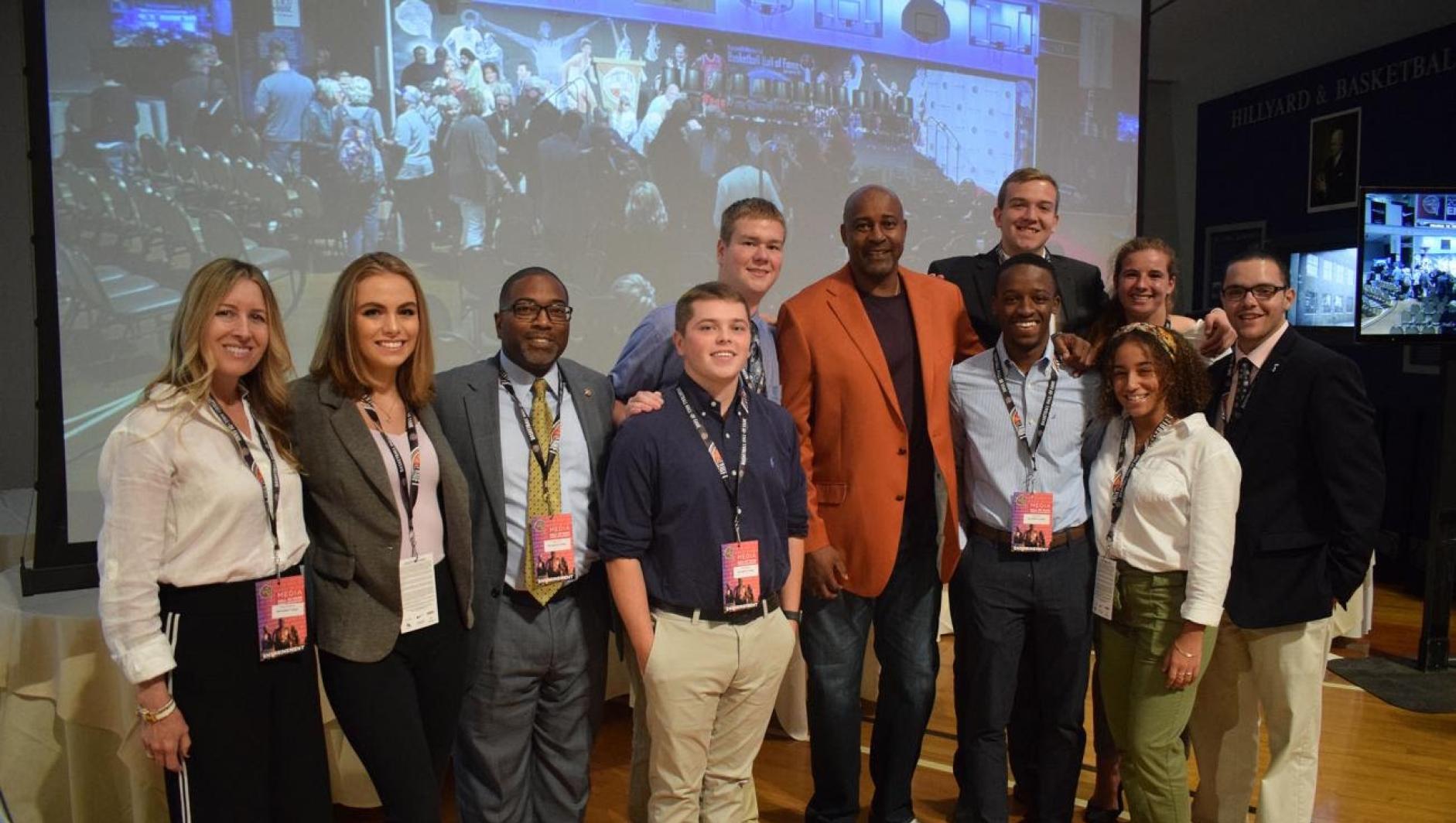 Springfield College students with Sidney Moncrief at the Basketball Hall of Fame. 