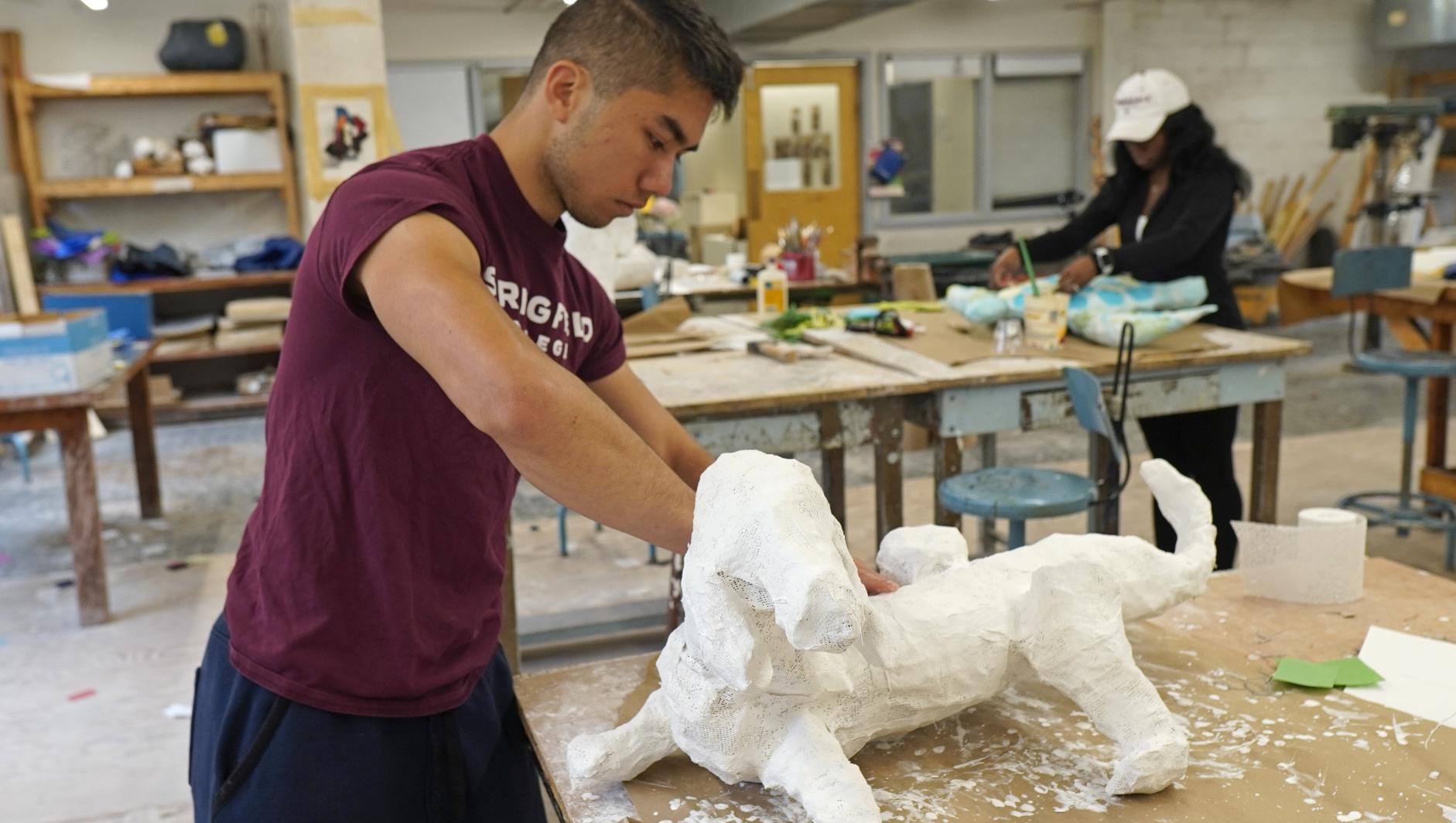 Art and design student sculpting