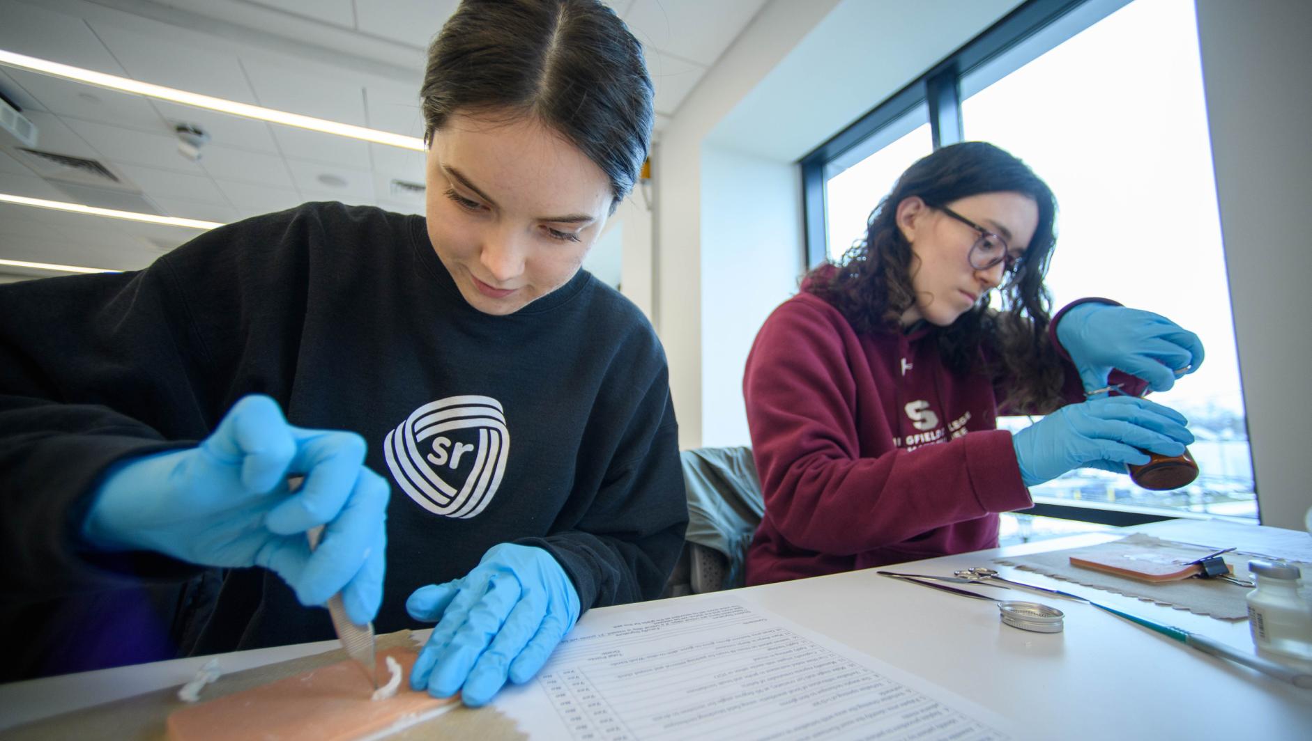 Springfield College Physician Assistant Studies students train how to administer hypodermic needles and drain abscesses inside the Health Sciences Center on Friday, February 2, 2024.