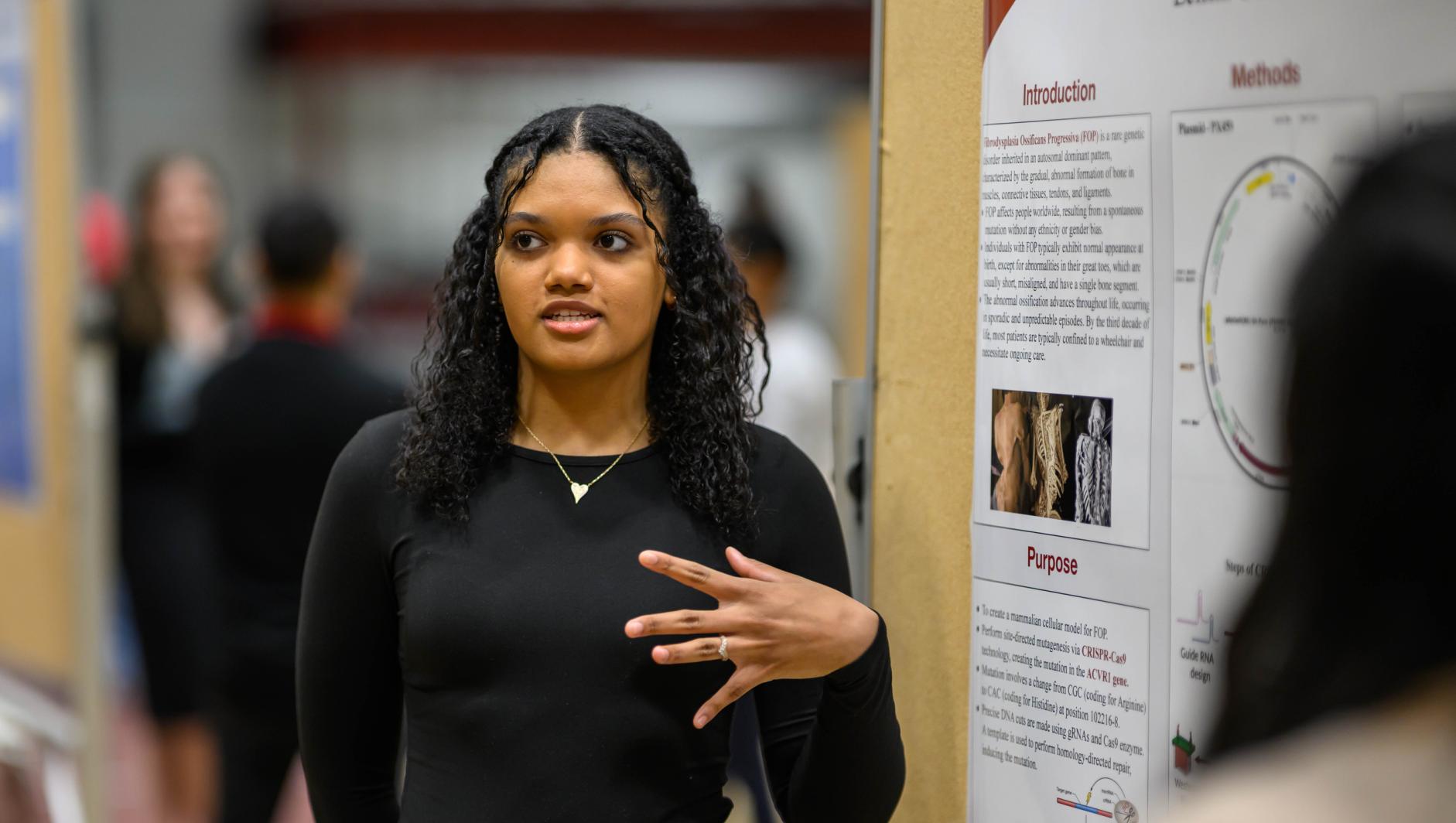 Springfield College 20th Anniversary of Scholar in Action Days female student presenting