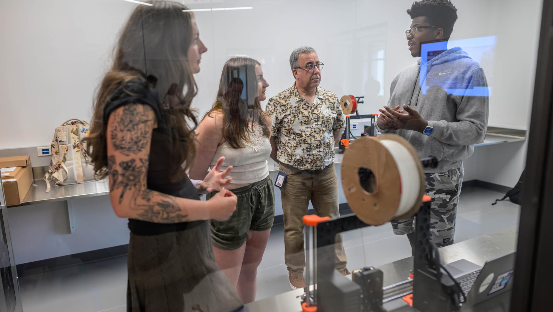 Amanda Rodriguez, assistant professor of occupational therapy, works with Springfield College Occupational Therapy students during a lab inside the Health Sciences Center