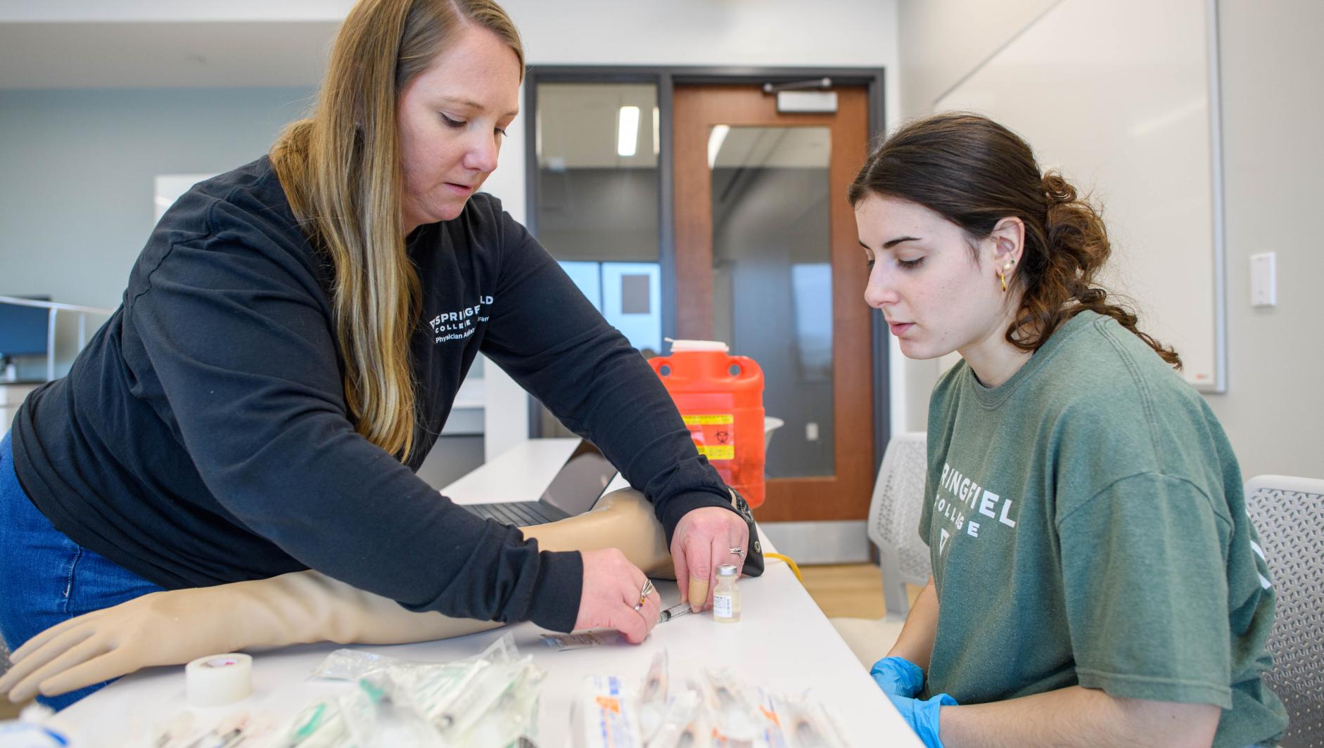 Springfield College Physician Assistant Studies students train how to administer hypodermic needles and drain abscesses inside the Health Sciences Center on Friday, February 2, 2024.