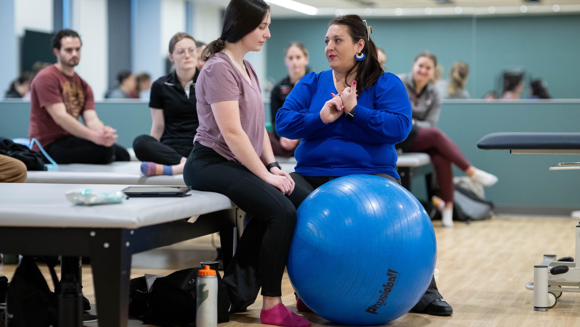 Physical therapy students work with community members during a Community Clinic in the Health Sciences Center at Springfield College on Tuesday, February 6, 2024