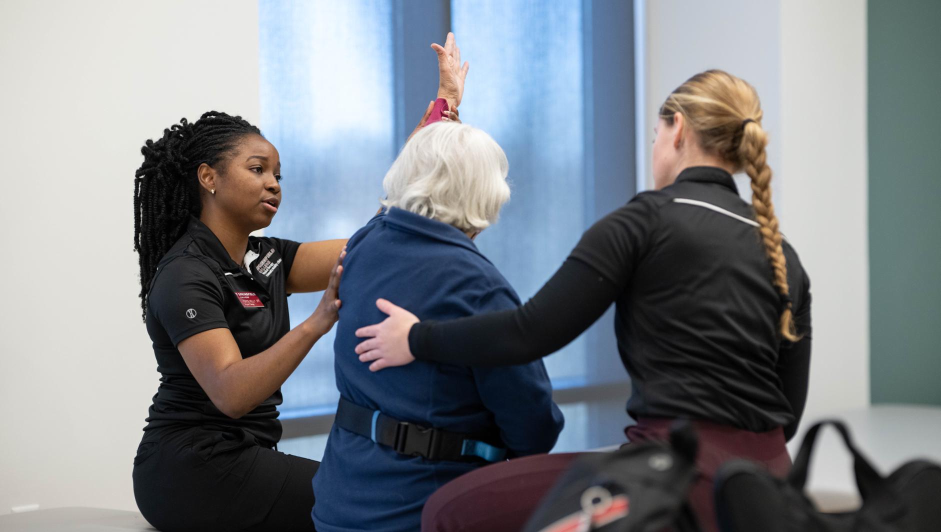Physical therapy students work with community members during a Community Clinic in the Health Sciences Center at Springfield College on Tuesday, February 6, 2024
