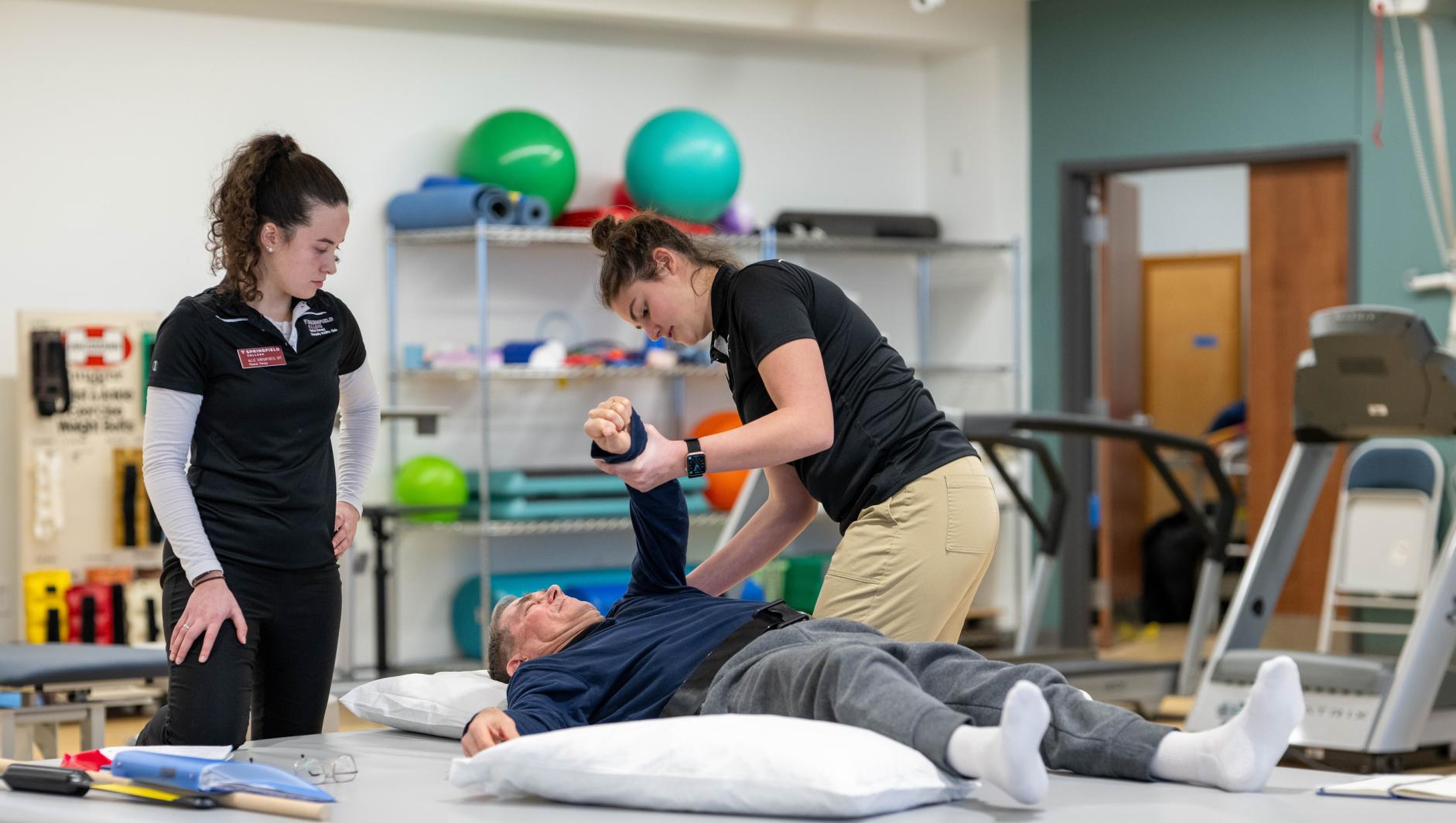 Physical therapy students work with community members during a Community Clinic in the Health Sciences Center at Springfield College on Tuesday, February 6, 2024