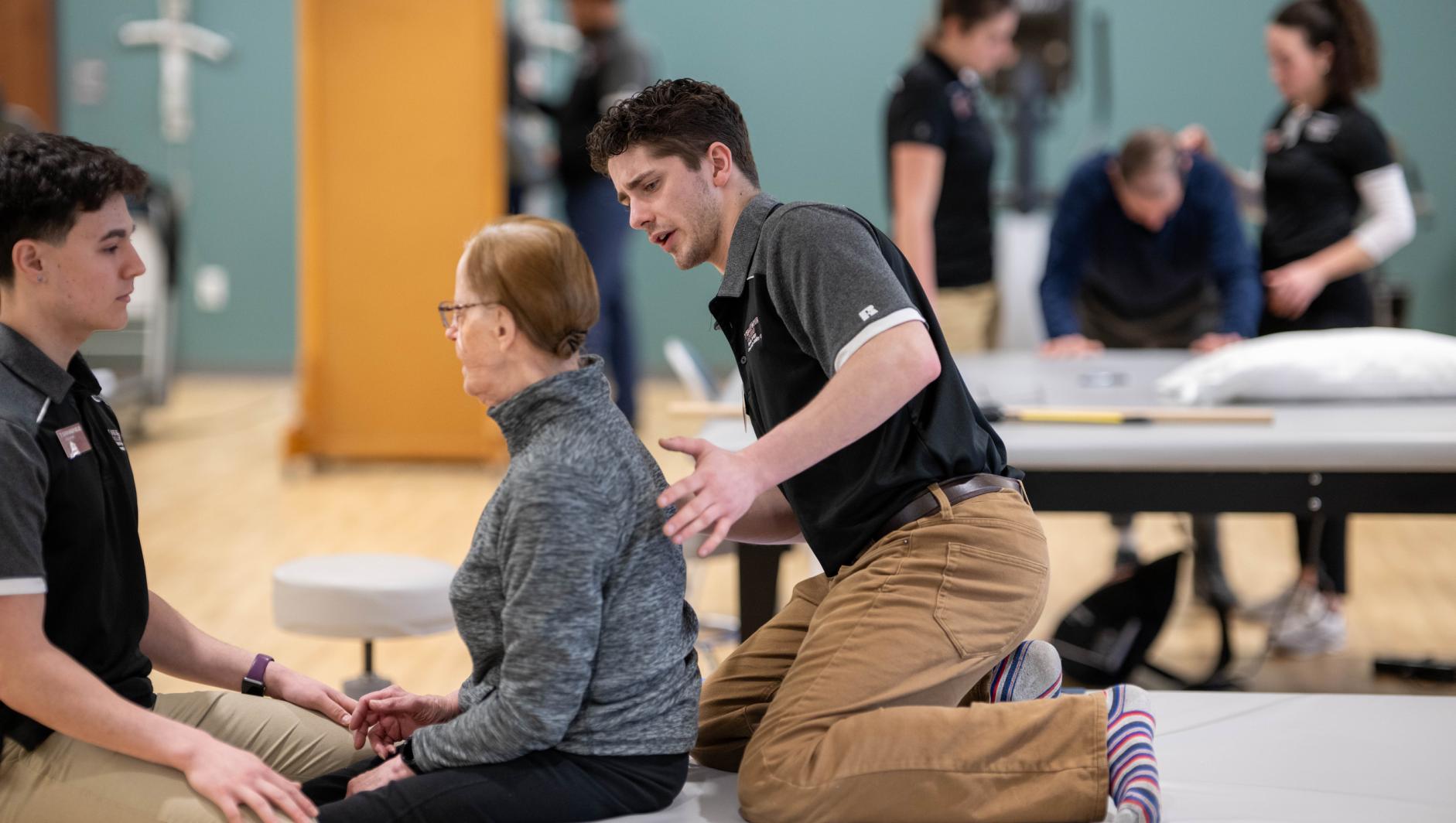 Physical therapy students work with community members during a Community Clinic in the Health Sciences Center at Springfield College on Tuesday, February 6, 2024