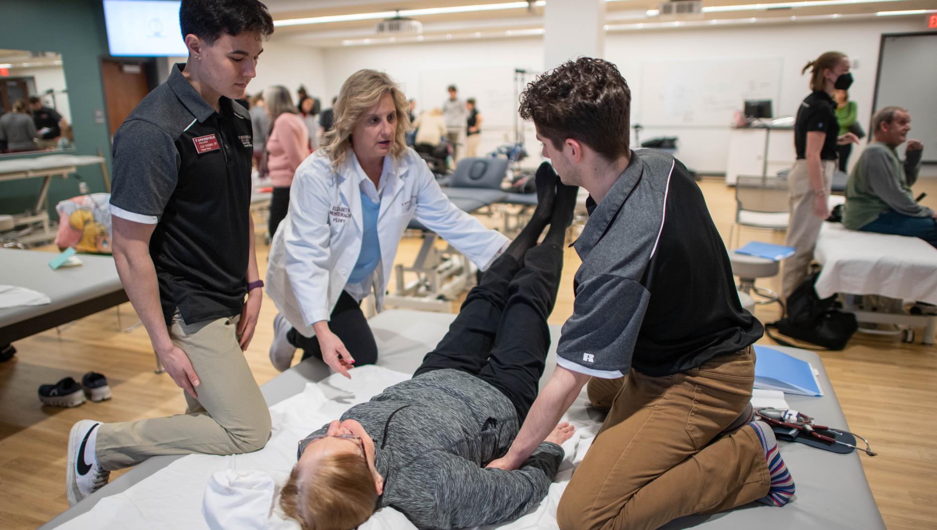 Physical therapy students work with community members during a Community Clinic in the Health Sciences Center at Springfield College on Tuesday, February 6, 2024