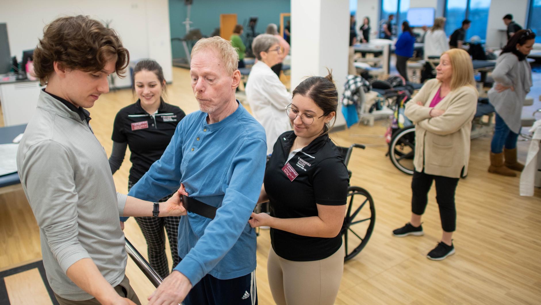 Physical therapy students work with community members during a Community Clinic in the Health Sciences Center at Springfield College on Tuesday, February 6, 2024