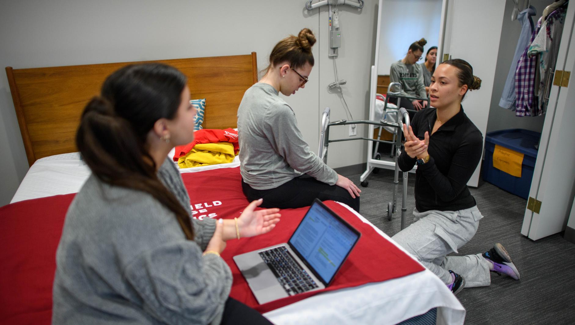 Springfield College Occupational Therapy students practice their clinical simulation competency inside the ADL Lab at the Health Sciences Center on February 15, 2024.