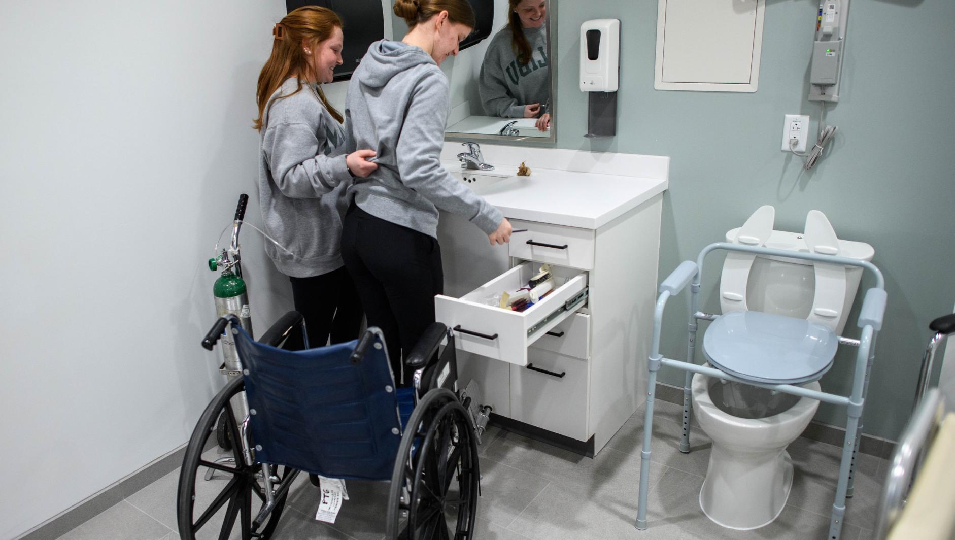 Springfield College Occupational Therapy students practice their clinical simulation competency inside the ADL Lab at the Health Sciences Center on February 15, 2024.