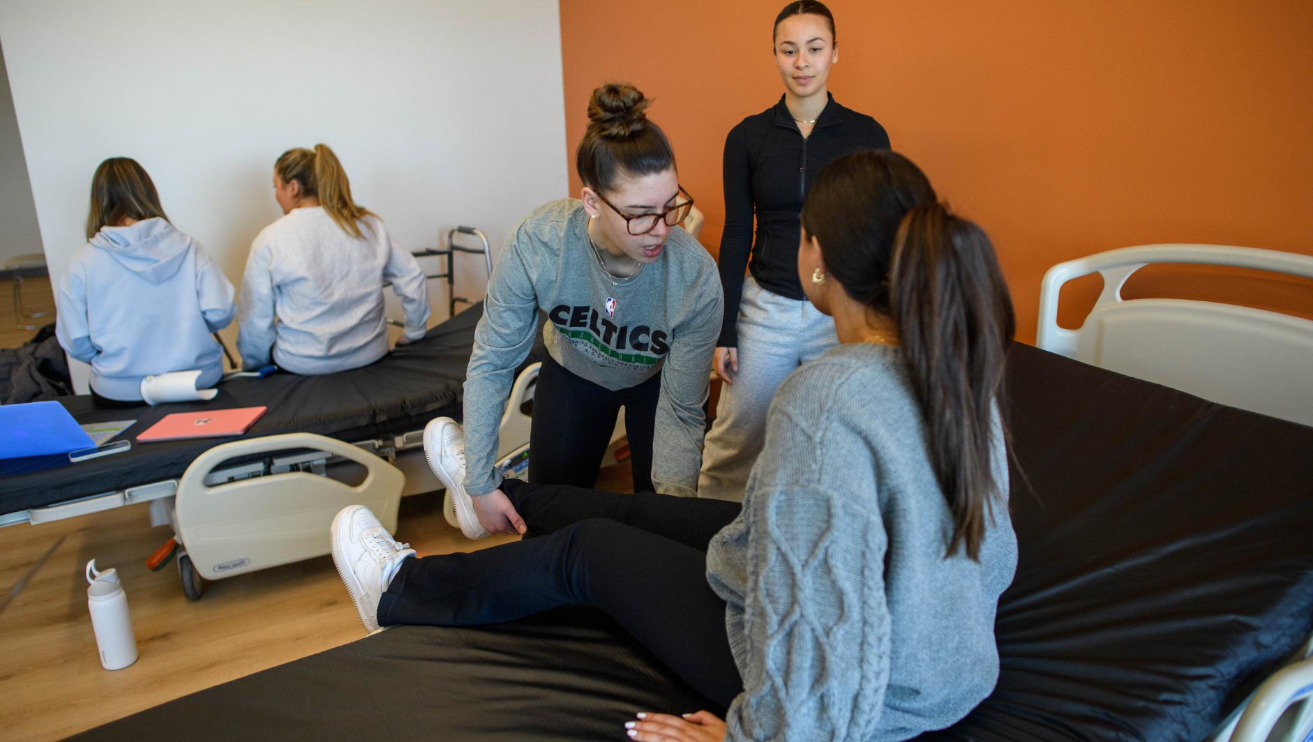 Springfield College Occupational Therapy students practice their clinical simulation competency inside the ADL Lab at the Health Sciences Center on February 15, 2024.