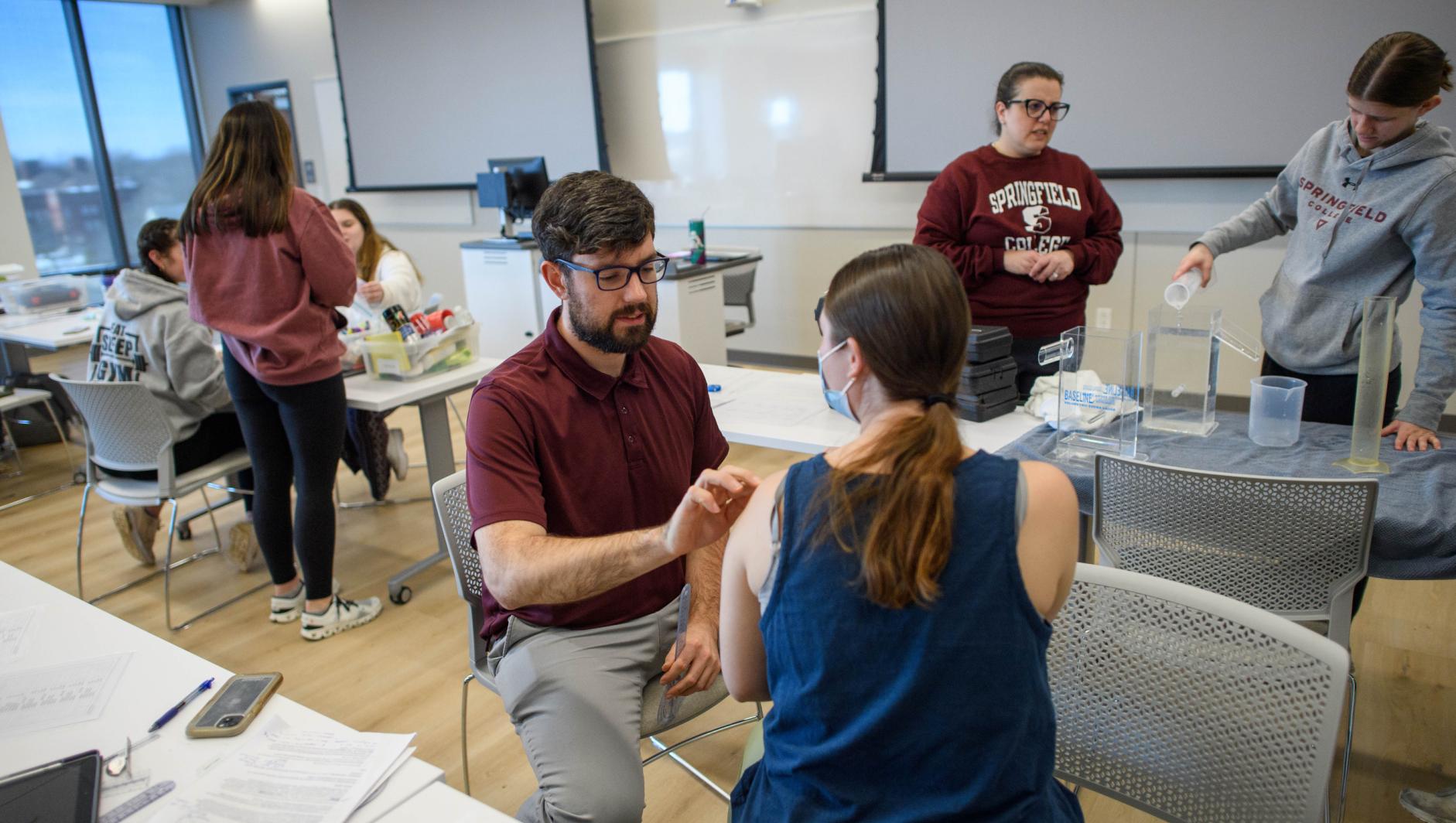 Springfield College Occupational Therapy students practice their clinical simulation competency inside the ADL Lab at the Health Sciences Center on February 15, 2024.