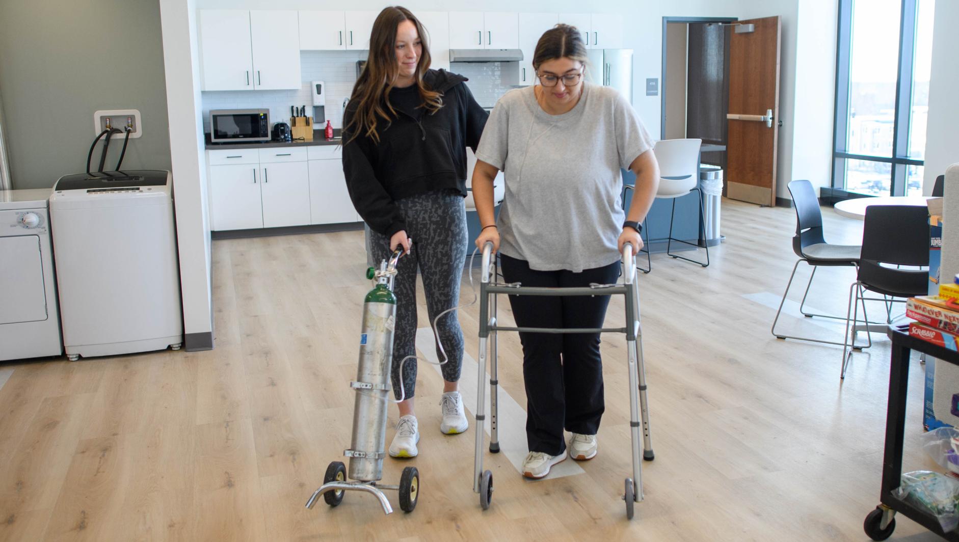 Springfield College Occupational Therapy students practice their clinical simulation competency inside the ADL Lab at the Health Sciences Center on February 15, 2024.