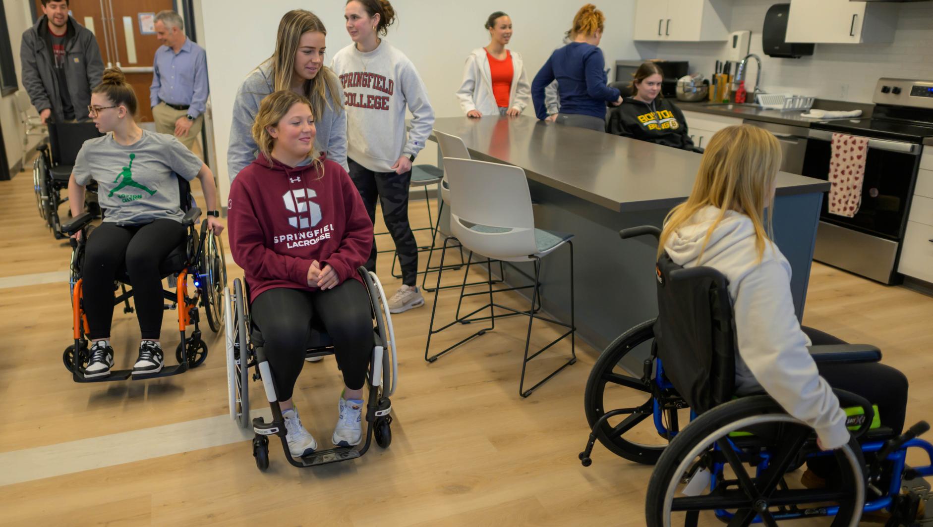 Springfield College Occupational Therapy Students learn about the wide variety of wheelchairs available to patients during a lab inside the Health Sciences Center on February 29, 2024.
