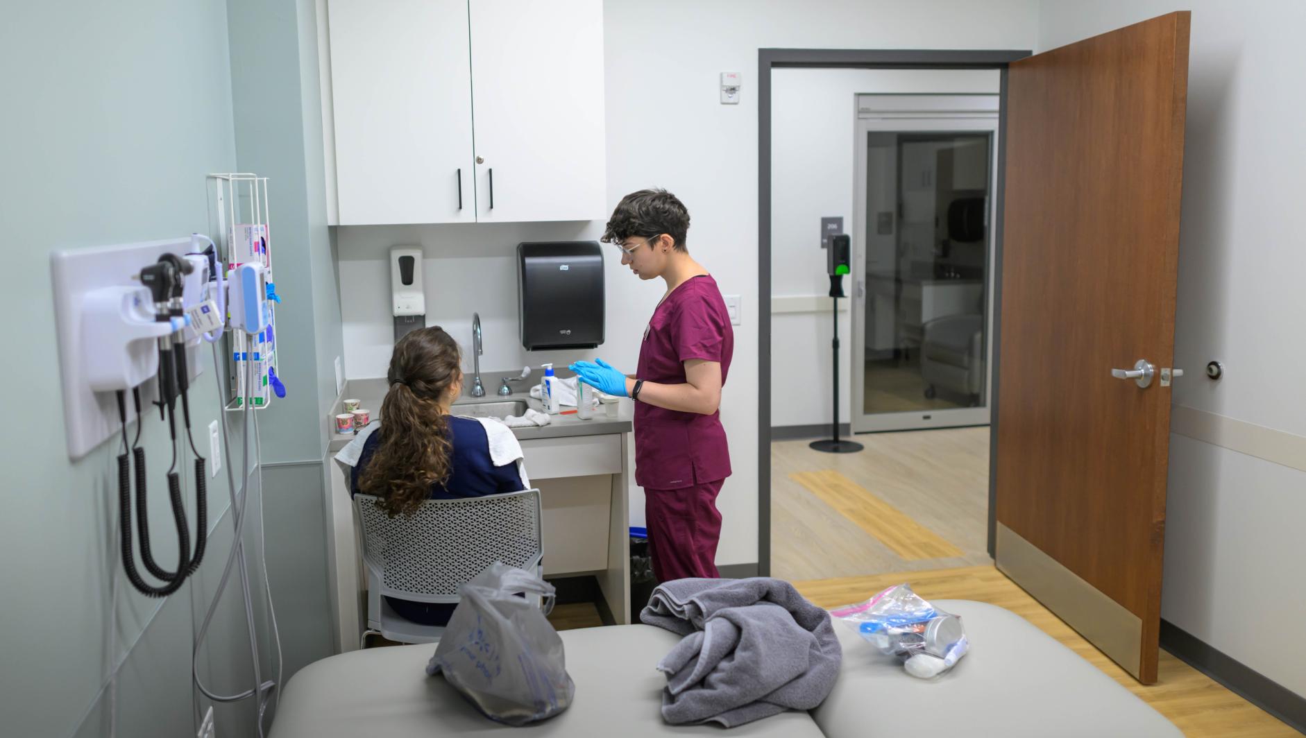 Springfield College Occupational Therapy students are encouraged to step outside their comfort zone as they are randomly paired with members of their cohort to practice providing clients with assistance to manage self care including bathing, dressing, toileting and grooming inside the Robotti Simulation Center on June 21, 2024.