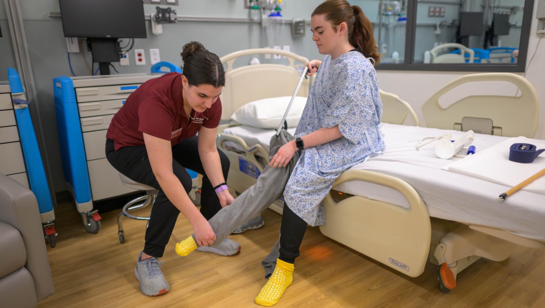 Springfield College occupation therapy students and Assistant Professor of Occupational Therapy Elizabeth Alicea-Torres train inside the simulation lab at the Health Sciences Center on April 23, 2024.