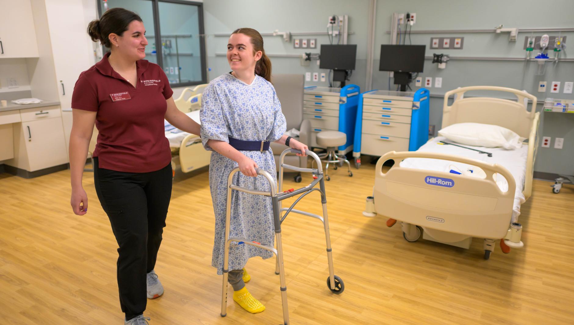 Springfield College occupation therapy students and Assistant Professor of Occupational Therapy Elizabeth Alicea-Torres train inside the simulation lab at the Health Sciences Center on April 23, 2024.