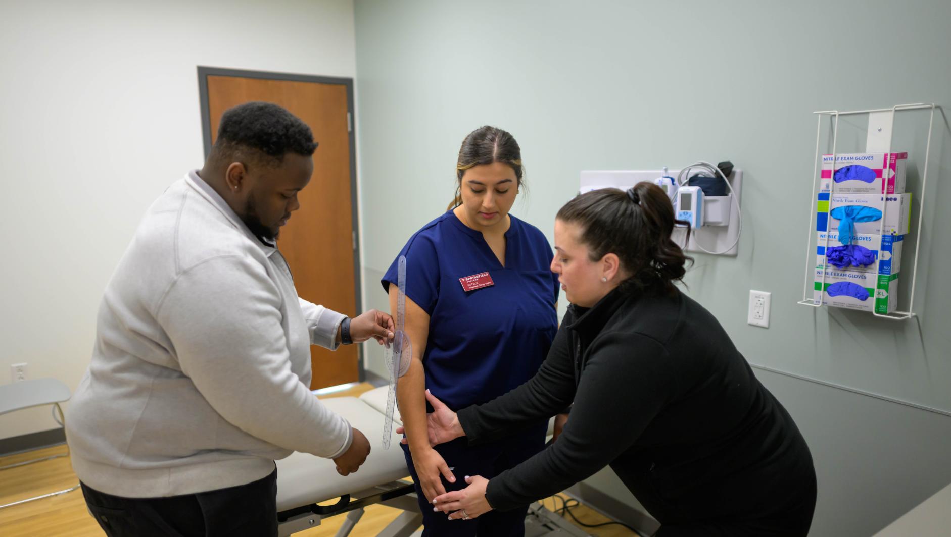 Springfield College Occupational Therapy students are encouraged to step outside their comfort zone as they are randomly paired with members of their cohort to practice providing clients with assistance to manage self care including bathing, dressing, toileting and grooming inside the Robotti Simulation Center on June 21, 2024.