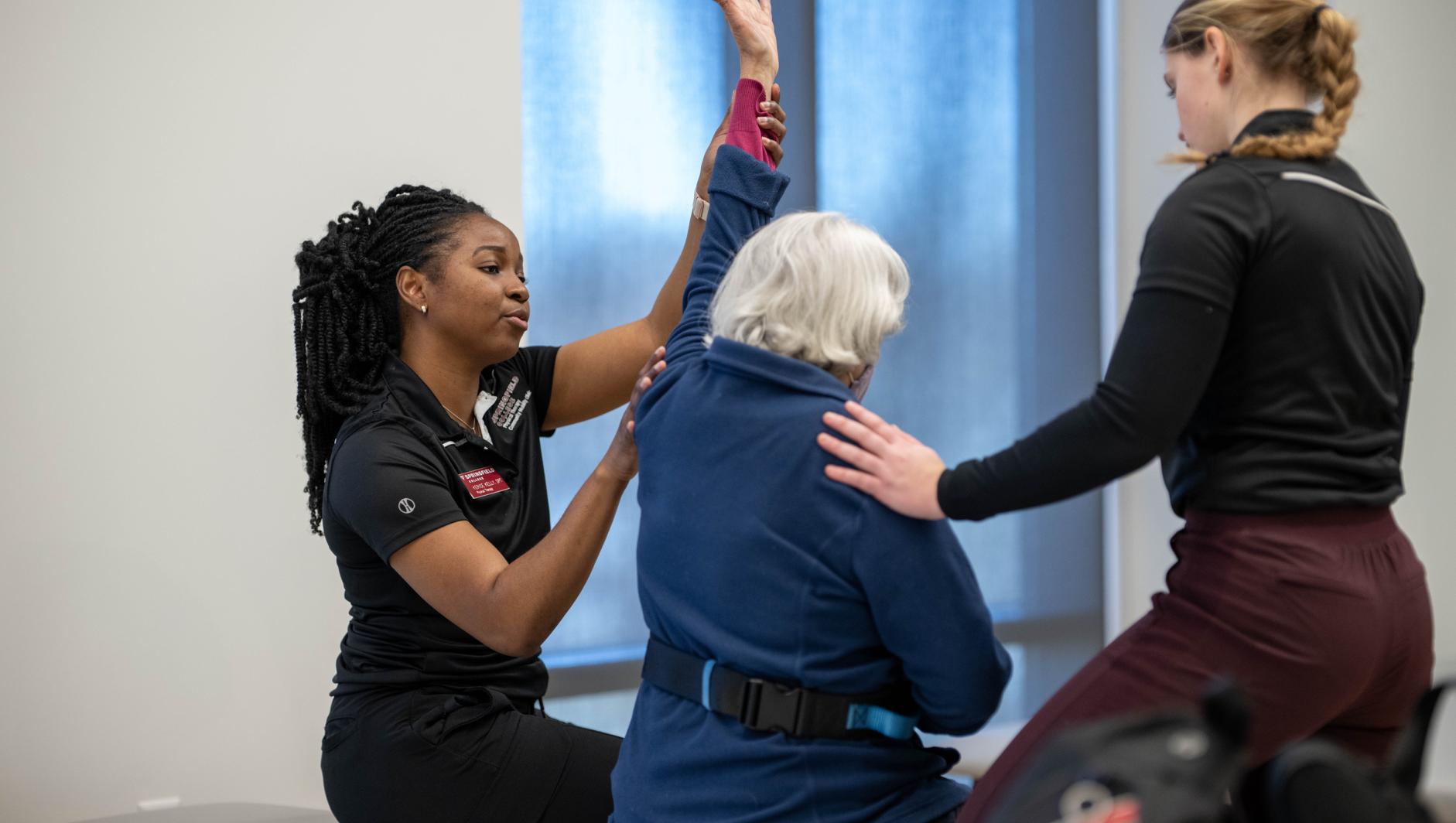 Physical therapy students work with community members during a Community Clinic in the Health Sciences Center at Springfield College on Tuesday, February 6, 2024