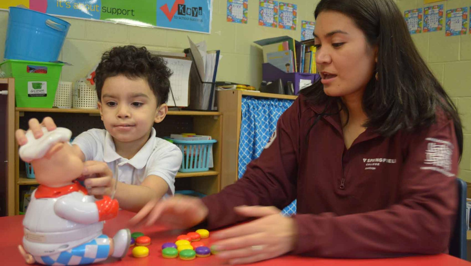 AmeriCorps member working with a young student