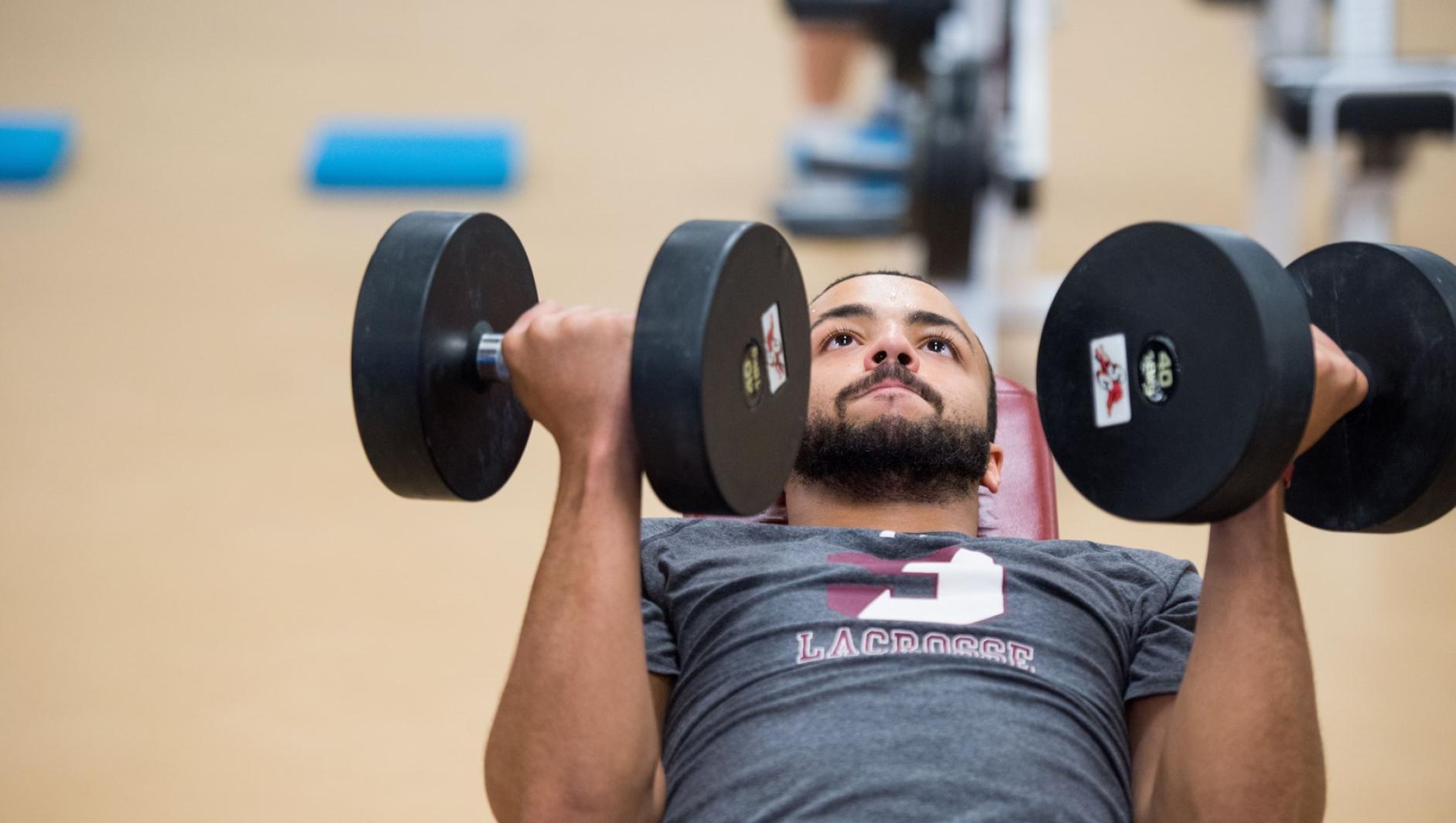 Student with dumbbells
